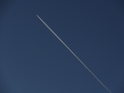 Letadlo rozčíslo podzimní oblohu nad Moravským krasem.